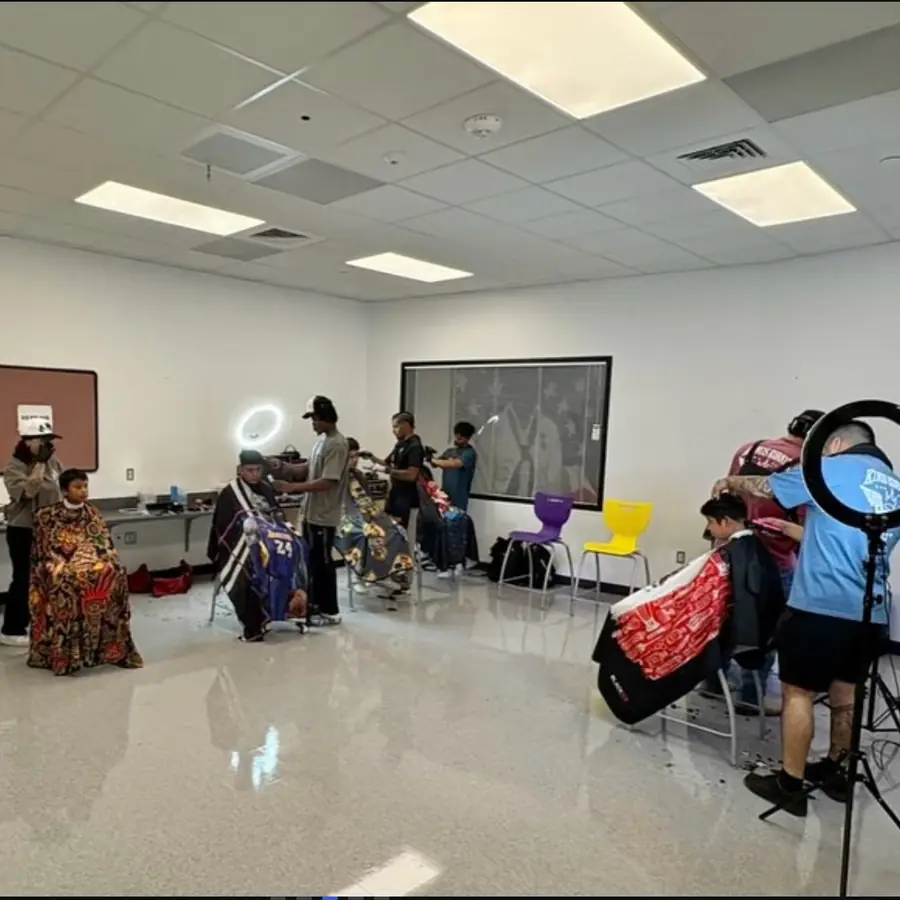 Kings Korner barbers at a San Marcos community event